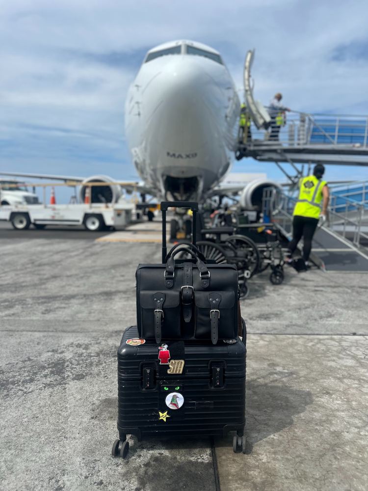Saddleback Flight Bag on Tarmac with Roller Luggage 